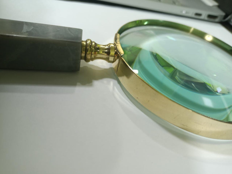 Brass magnifying glass with branding
